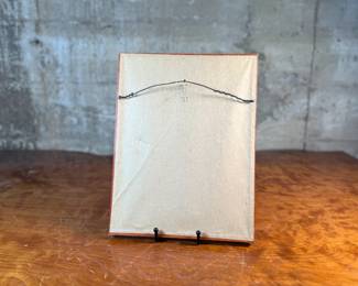 "Smoke Dreams", a hand-signed lithograph by listed artist, Alberto Vargas. Professionally framed and measures in frame, 12.75” H x 9.75” W. Vargas was a prominent 20th-century illustrator known for his sensual pin-up girl paintings that appeared in magazines like Esquire and Playboy. "Smoke Dreams" is one of the artist’s favorite works from the 1920s.

