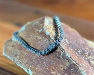 This lot features a genuine diamond tennis bracelet, set in sterling silver and features forty-eight (48) diamonds. The bracelet measures, 7.5” and has a total approx. weight of 11.44 grams.

