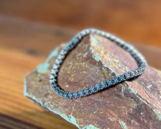 This lot features a genuine diamond tennis bracelet, set in sterling silver and features forty-eight (48) diamonds. The bracelet measures, 7.5” and has a total approx. weight of 11.44 grams.

