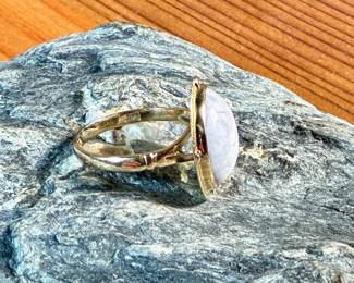 This lot features a stunning 14k gold ring with a lavender jade center stone in a size 6. Total approx. weight is 3.27 grams.

