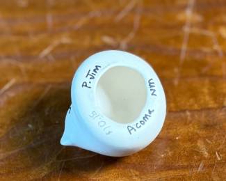 This lot features a curated collection of Native American items including sculptures, Acoma potttery, and more.

