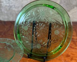This lot features two pieces of antique uranium items including a cake plate and stand. Both glow under a black light and the platter measures, 10” H x 10” W.

