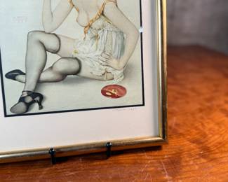 "Smoke Dreams", a hand-signed lithograph by listed artist, Alberto Vargas. Professionally framed and measures in frame, 12.75” H x 9.75” W. Vargas was a prominent 20th-century illustrator known for his sensual pin-up girl paintings that appeared in magazines like Esquire and Playboy. "Smoke Dreams" is one of the artist’s favorite works from the 1920s.

