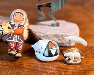 This lot features a curated collection of Native American items including sculptures, Acoma potttery, and more.

