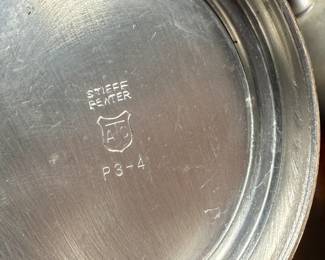 This lot features a pewter coffee & tea service set with various items manufactured by Stede, Stieff, & Royal Holland Pewter.

