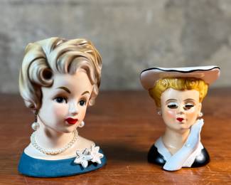 This lot features a pair of vintage lady head vases by Inarco & Nippon, circa 1950s. The largest measures, 5.5” H. 

