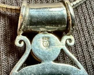 This lot features a beautiful sterling silver necklace with a silver & turquoise pendant. The chain measures, 18” and the necklace has a total approx. weight of 21.60 grams.

