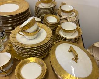 Limoges china featuring a classic white design with extensive gold trim