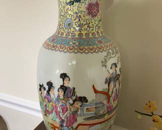 One of a pair of Famille Rose porcelain vases, 18 1/2” tall, featuring 12 ladies playing music.  The homeowner has owned these over 35 years!  Excellent condition 
