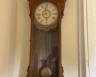 Antique carved walnut Eastlake-style vase with glass front long-drop wall clock, works perfectly.  Believed to be an E. N. Welch “Sembrich “ wall clock from Connecticut