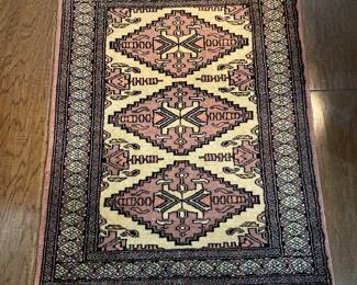 Mauve and black Bokhara rug 36” x 25”