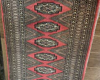 Hand-knotted made in Pakistani wool Bokhara-style rug in salmon and black 48” x 32”