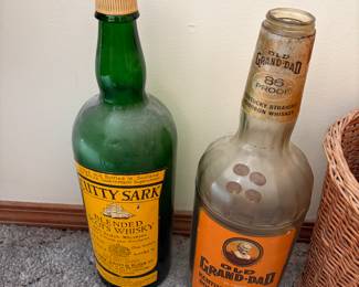 Large, glass whiskey bottles