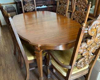 Dining table with ornate chairs