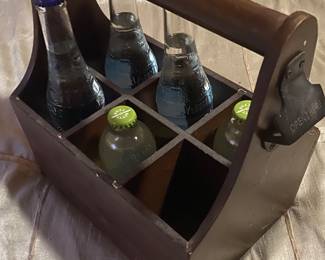 Wooden six pack carrier with built in bottle opener