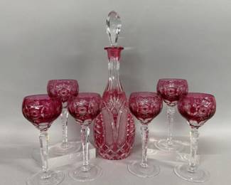 Cranberry crystal decanter, six hock glasses