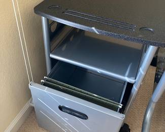 26	130.00	Glass top desk 56W X28D X 30H with 2 mobile file cabinets  18W X 20D X 23H
