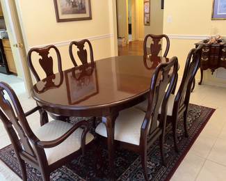 13		$700 - Thomasville Oval Queen Ann style table  68W X 43D X30H  and 2 -  20" leaves with 6 highback chairs (2 with arms)
