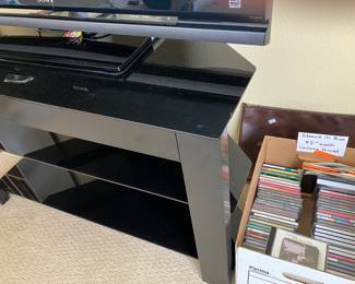 29	100.00	Dark Glass TV  Stand 40W X 14D X 24H
