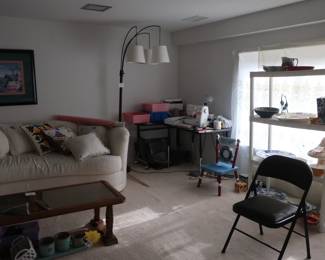 finished lower level with decor, sewing machine, sofa etc