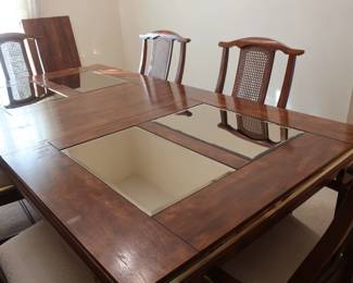 Dining room table and 6 chairs size is 66" x 44" it has two 18" leaves
