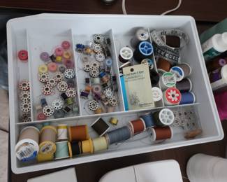 bobbins  and  thread  that  go  with  sewing  machine