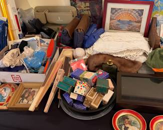 Avon  leather items ,lace linens crochet linens ,fans and many more unusual items 