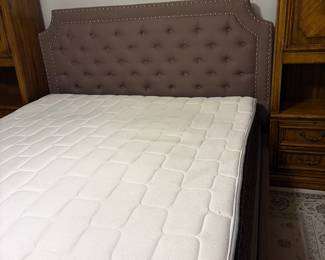 Grey upholstered bed with mattress 