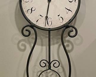 HOWARD MILLER WROUGHT IRON PENDULUM WALL CLOCK