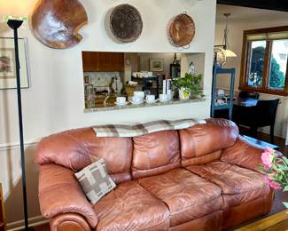 Sienna leather couch and wall art