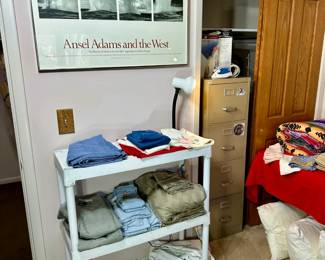 framed art, file cabinet, linens, shower curtain