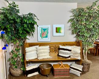 Antique church pew, decorative pillows, decorative trees
