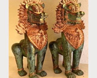 Antique Chinese Bronze Foo Dogs with gold gilt and natural patina. They measure approx. 16” tall and are quite striking decor pieces.