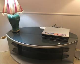 PRE SALE—AVAILABLE NOW. BEAUTIFUL AND MODERN TV/STEREO STAND. GLASS TOP IS REMOVABLE. 4 shelves for components . Like new condition. $60.00