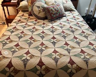 Double bed that has 2 matching dressers. But that QUILT, beautiful!
