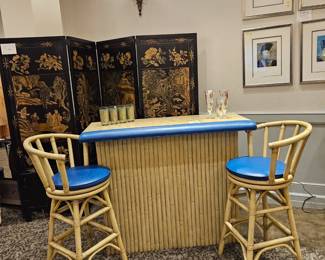 Mcm Tiki bar with plenty of storage and 2 swivel chairs, bamboo styling and capiz shell bar top