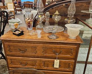 Antique cabinet, gas lamps, vases