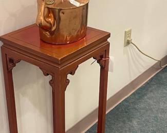 Carved plant stand, one of two copper pots