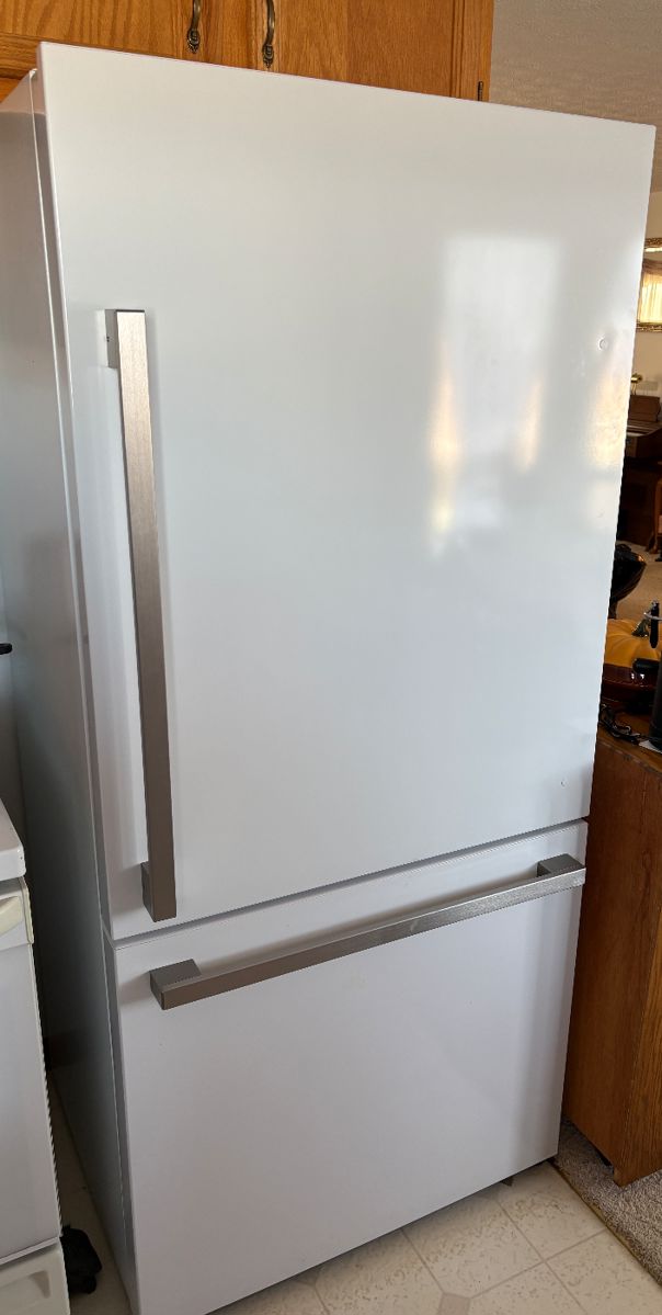 Refrigerator is less than 1 year old; HiSense; approx 31.25x26.5x69