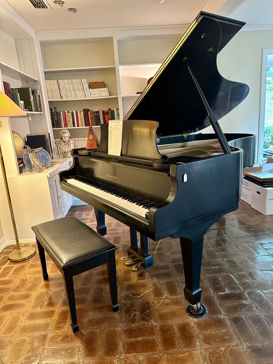 Samick grand piano ready to be played.  Tuned regularly and last tuned last year.  Never moved.