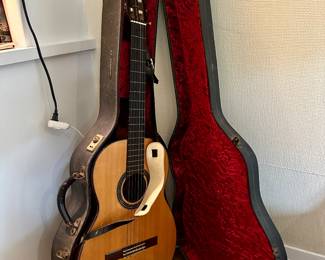 Guitar and case in excellent condition - early 1960's. Can't remember maker.