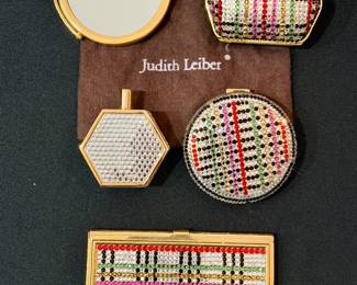 Large collection of Judith Leiber cases, mirror, compact, and perfume "flask"