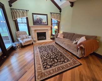 Great staging pieces, Seude couch.  Walter e Smithe , neutral pillows and rug.  Art, Fruit, large