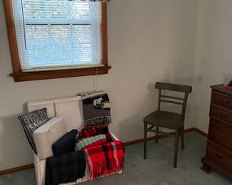 White wicker blanket chest; throw pillows, afgans, patterned throw & fleece blankets, etc