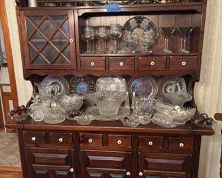 Pewter platters & other serving pieces, crystal, stemware. One of 2 styles of vintage wood display hutches available.