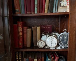 Books, clocks and antique camera 