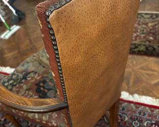 Needlepoint chair back detail of leather