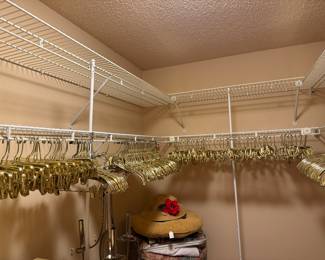 Gold plastic hangers for a glamorous looking closet!!