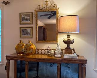 Mid-century console table with mirrored back wall