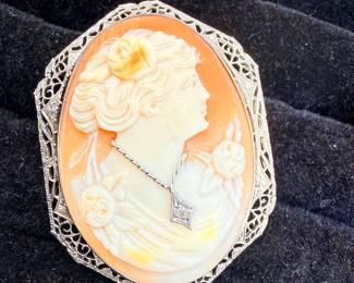 White gold filigree shell cameo brooch/pendant featuring a woman's profile with a small diamond accent